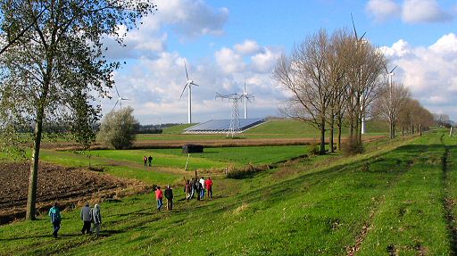 Walking through the Dutch polder-mud to get the best view of Eneco's spectacular combined wind/solar plant with  a waste gas regeneration project north of Waalwijk, NB (NL).